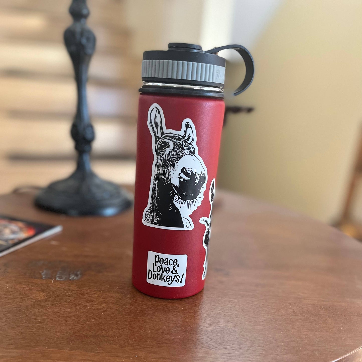 Donkey sticker Charlie on red tumbler
