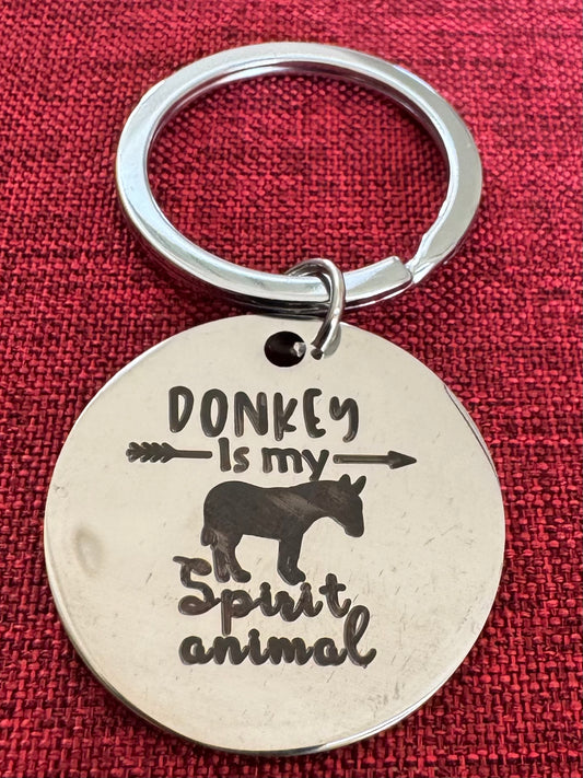 Keychain with 'Donkey is my spirit animal' text on a red background